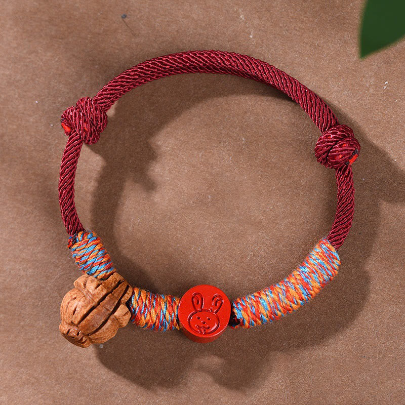 Handmade Chinese Zodiac Red String Peach Pit Cinnabar Luck Bracelet