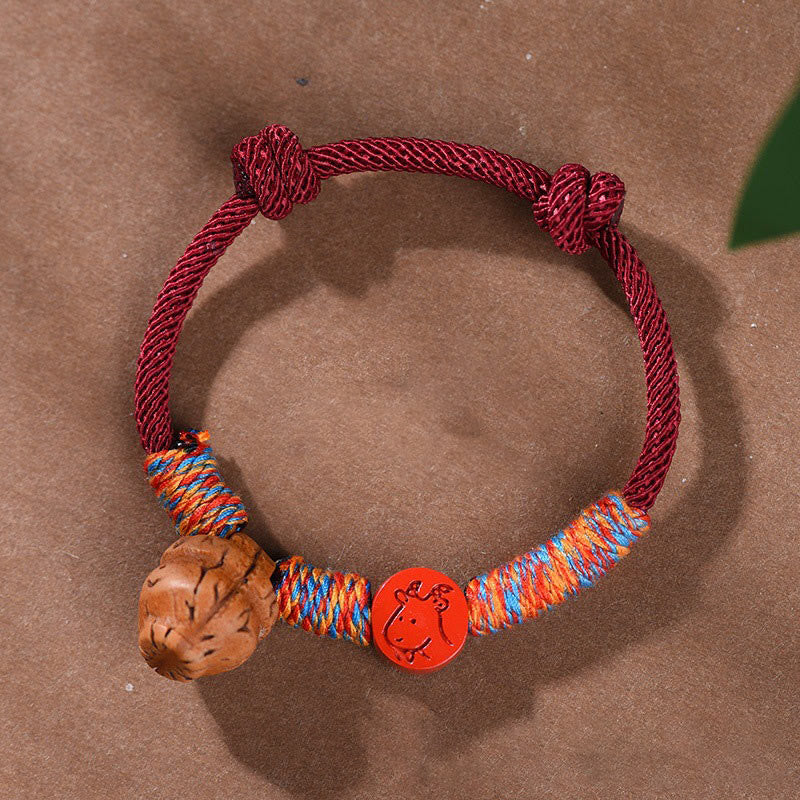 Handmade Chinese Zodiac Red String Peach Pit Cinnabar Luck Bracelet
